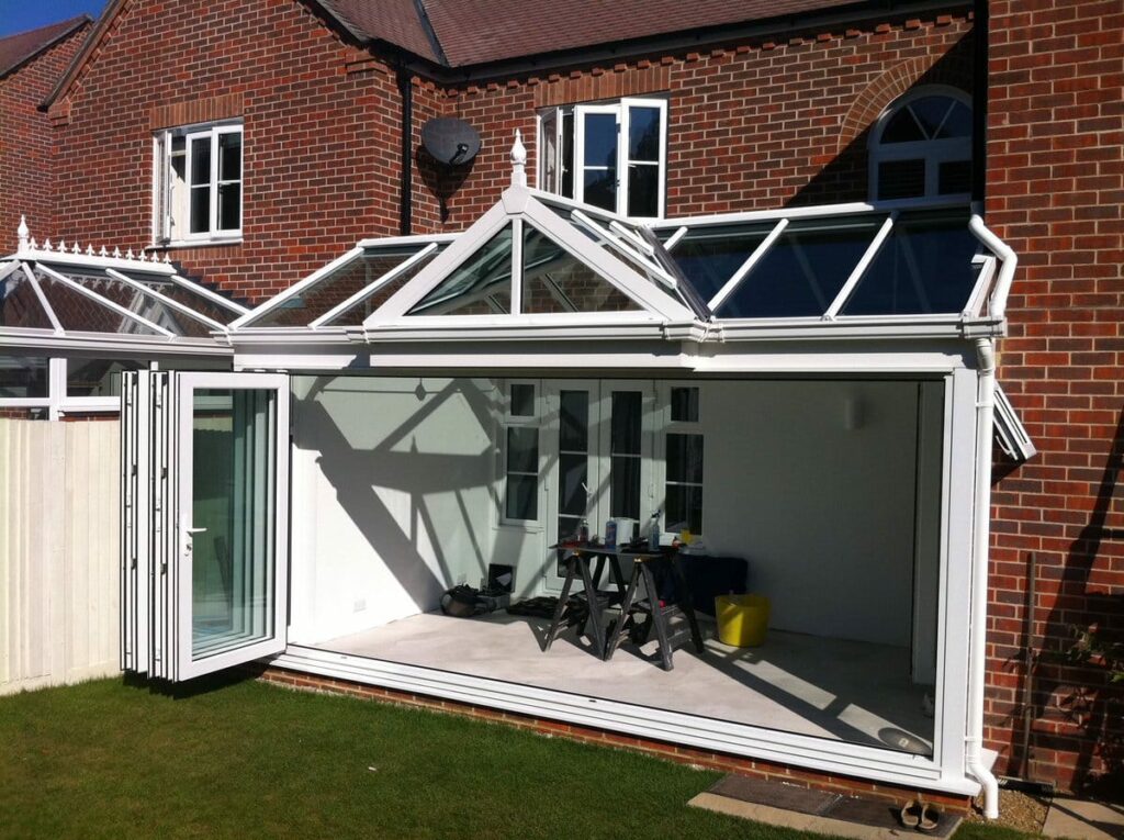 White folding doors in a conservatory.