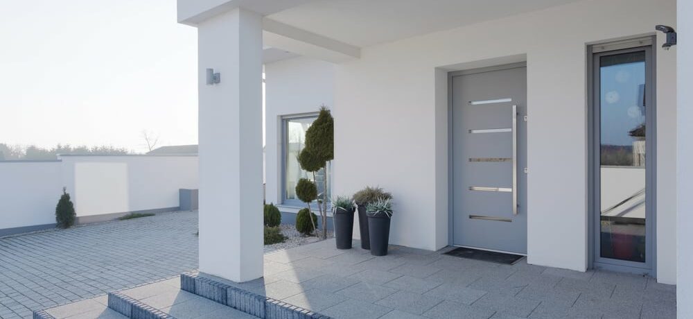 aluminium front doors in a modern white house