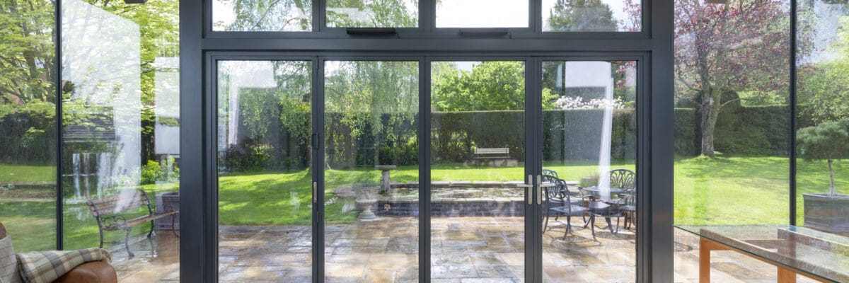 steel look bifolding doors in a modern extension with lovely garden views