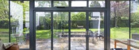 steel look bifolding doors in a modern extension with lovely garden views