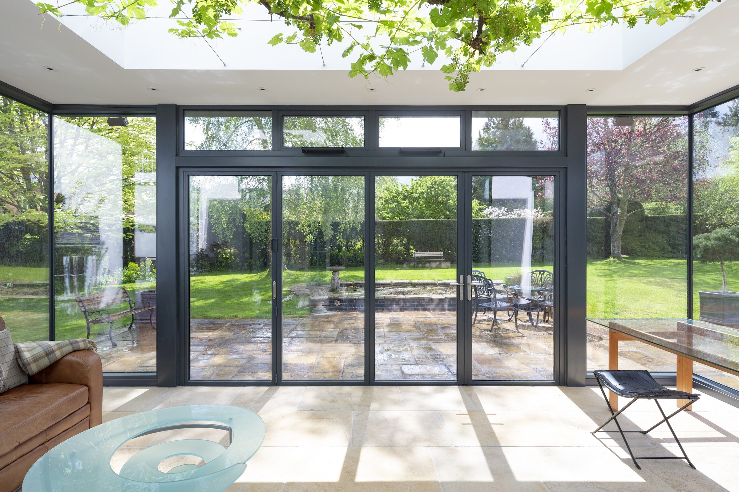 steel look bifold doors in a modern extension with lovely garden views