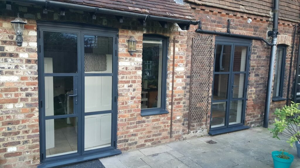 steel look patio doors in Tonbridge to a mock tudor house