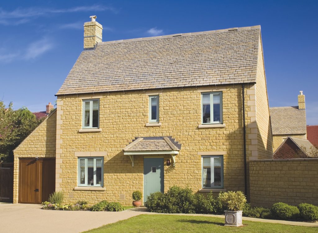 alitherm 400 window in a new build home with cotswold stone and tiled roof