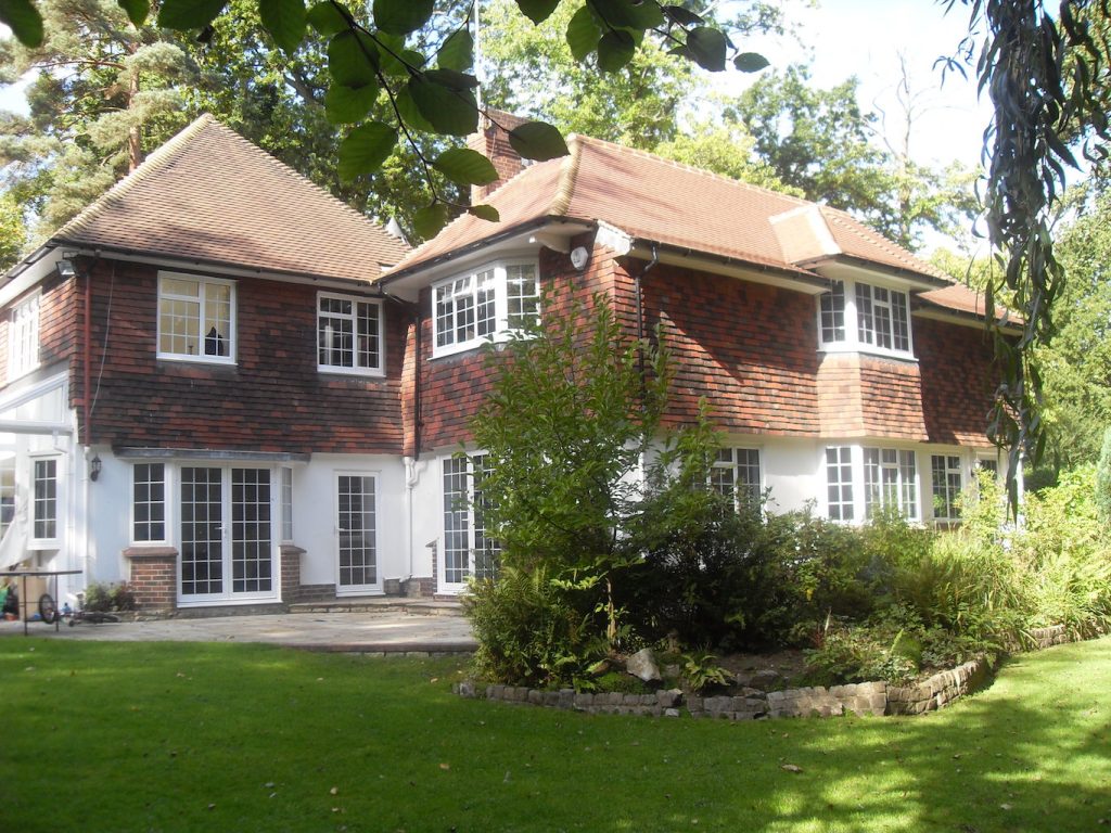 ALUK OPTIO 58BW HI windows in a traditional style detached house in Orpington