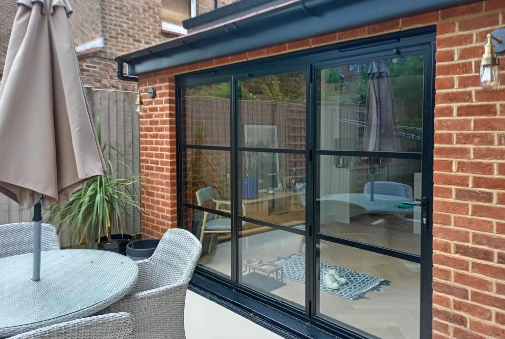 industrial style patio doors in a bifold design external view.