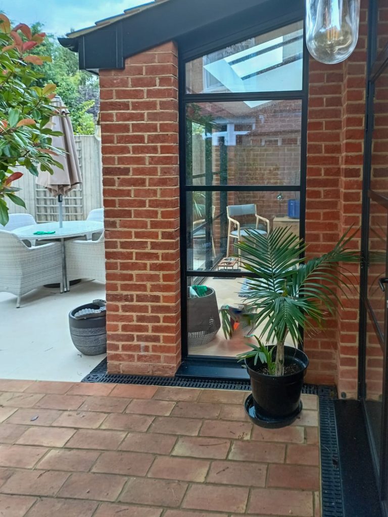 heritage style picture window in a brick built extension with sloping head