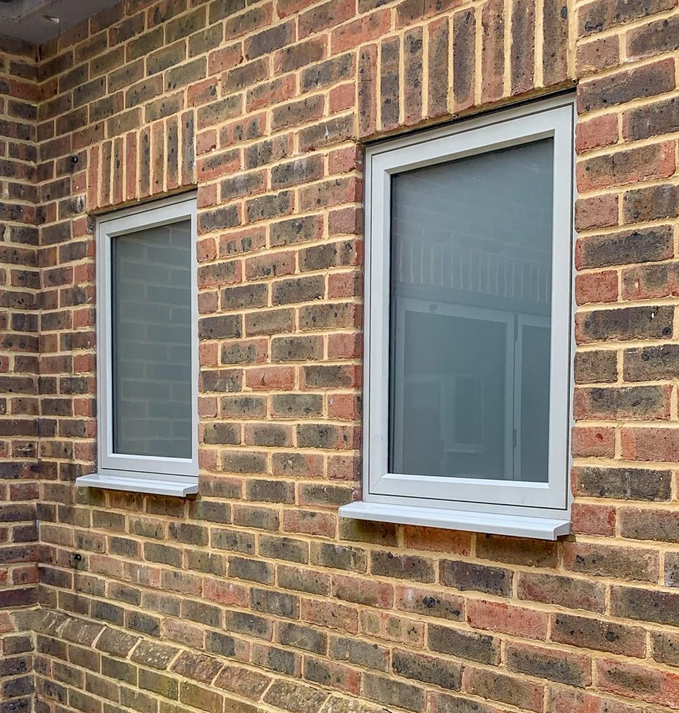 windows in brickwork with acid etched glass